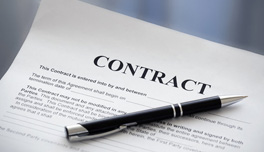 photo of a contract with a pen